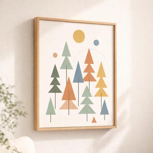 May include: Geometric art print featuring a stylized forest scene. The artwork includes colorful triangular trees in shades of green, orange, blue, and yellow, with a yellow sun and a blue dot against a cream background. The print is framed in a light wood frame.