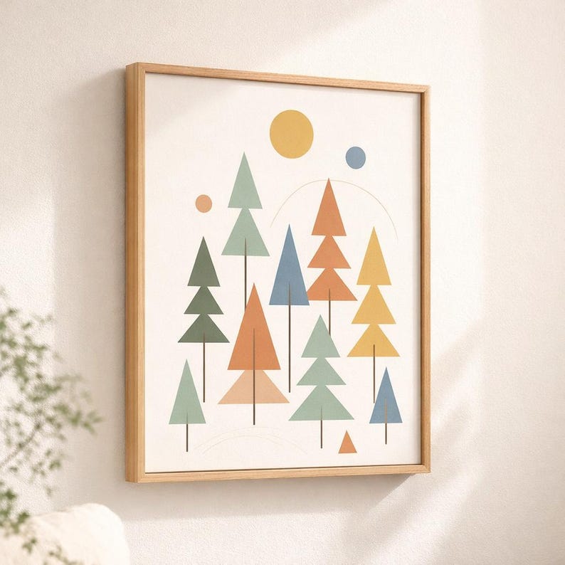 May include: Geometric art print featuring a stylized forest scene. The artwork includes colorful triangular trees in shades of green, orange, blue, and yellow, with a yellow sun and a blue dot against a cream background. The print is framed in a light wood frame.