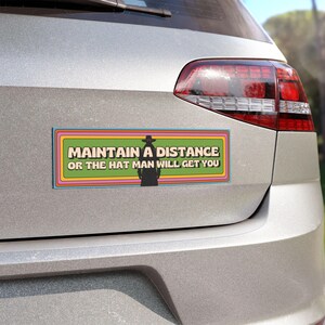 a close up picture of the bumper magnet on the back of a silver van