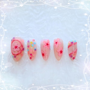 May include: A set of three ceramic mugs with a speckled, matte finish in blue, green, and white. Each mug has a rounded shape and a simple, modern design. Suitable for coffee, tea, or other drinks.