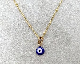 Dainty evil eye necklace on a 17" gold-plated anti-tarnish chain for a protection charm or a witchy aesthetic