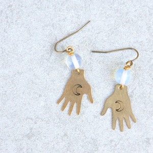 Brass palmistry earrings, witch hand earrings holding a moon, fortune teller earrings, palm reader earrings, mystical earrings