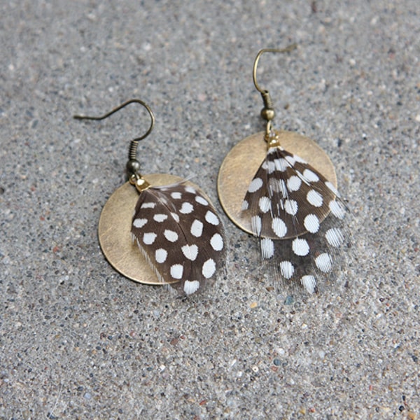 Guinea feather earrings with a brass accent, for when you want feather earrings but also polka dot earrings