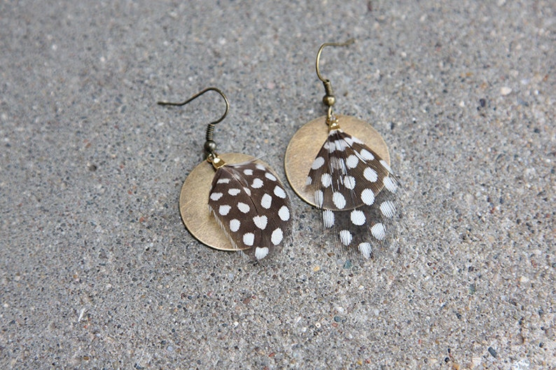 Guinea feather earrings with a brass accent, for when you want feather earrings but also polka dot earrings image 1