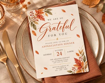May include: A rectangular invitation card featuring autumn leaf illustrations in orange, red, and brown. The text reads: WE ARE SO Grateful FOR YOU, PLEASE JOIN US FOR AN APPRECIATION DINNER, SATURDAY OCTOBER 24 6:00PM, THE AMAZING HARVEST, 123 ANYWHERE PLACE, ANY CITY, AA 12345, RSVP TO ASHLEY BY OCTOBER 10 123-456-7890.