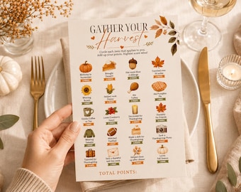 May include: A rectangular game card titled Gather Your Harvest with a fall-themed design. The card features a grid of icons including pumpkins, leaves, and food, each with associated point values and text prompts for a Thanksgiving activity.