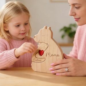 May include: A wooden bear-shaped decorative item with a smaller bear cutout, a red heart, and the word "Mama". The item is personalized with the word "Custom" and is held by a woman and a young girl.