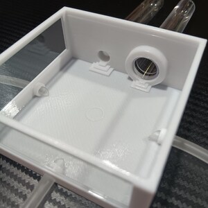 a close-up of the ant farm itself with everything hooked up, minus the lid.