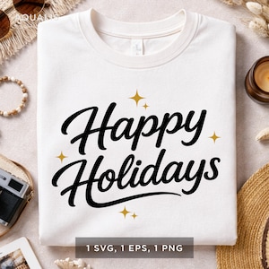 May include: White sweatshirt with the text "Happy Holidays" in a black script font, accented with gold starbursts. The design is centered on the front of the shirt. The bottom of the image shows "1 SVG, 1 EPS, 1 PNG".
