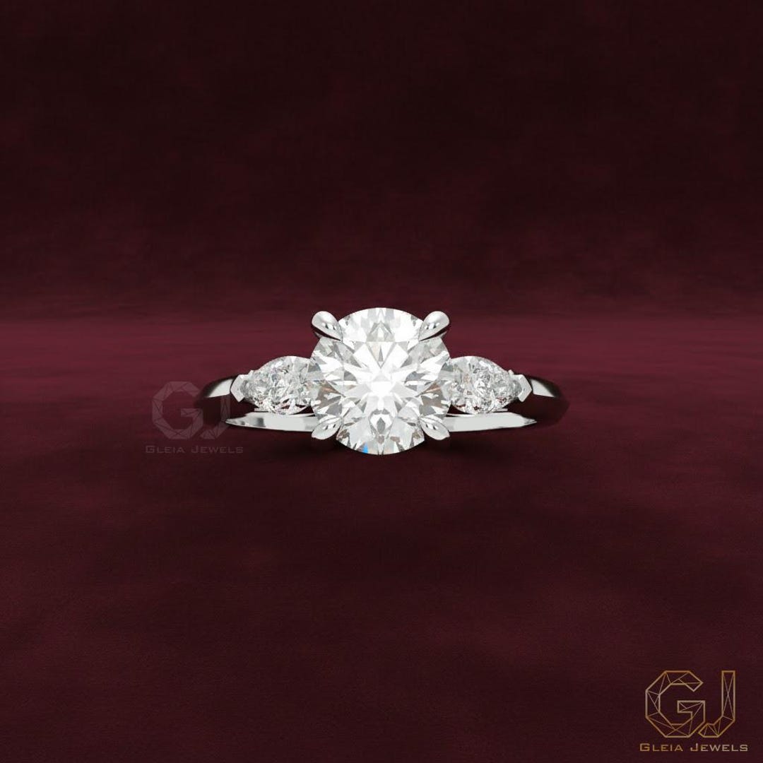 Round Diamond Three Stone Engagement Ring With Pear Side Stones ...