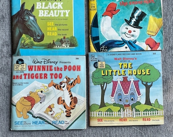 May include: Four vintage Disneyland and Little Golden Book and Record sets featuring The Story of Black Beauty, Frosty the Snow Man, Winnie the Pooh and Tigger Too, and The Little House. Each square cover displays colorful illustrations and titles.