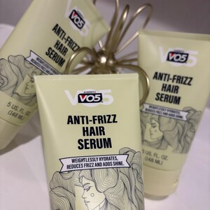 May include: Several tubes of Alberto VO5 Anti-Frizz Hair Serum are displayed. The tubes are light yellow with black and white text and a drawing of a woman's profile. Each tube contains 148 ml of serum.