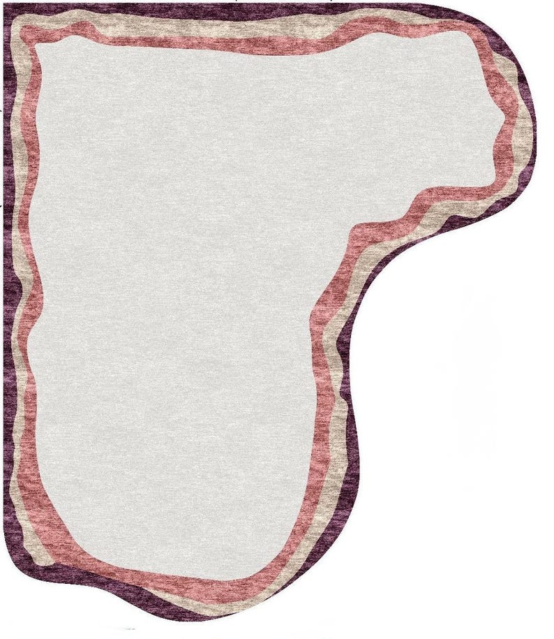 May include: A uniquely shaped rug with a light gray center, bordered by wavy lines of pink, beige, and deep purple. The rug's design features a soft, textured appearance, suitable for home decor.