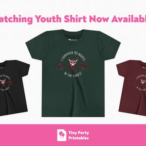 May include: Three youth t-shirts in black, forest green, and maroon. Each shirt features a graphic of a creature with the text "I survived 99 nights in the forest". The text "Matching Youth Shirt Now Available!" is at the top.