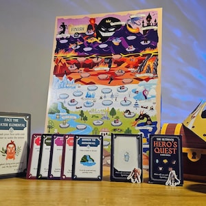 May include: A board game setup featuring a colorful game board with various illustrated locations. The game includes cards, miniature figures, a treasure chest, and a golden crown. The game is titled "The Ultimate Hero's Quest".