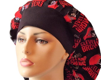 May include: Black scrub hat with a red and white print of the Cleveland Browns logo. The hat has a tie at the back.