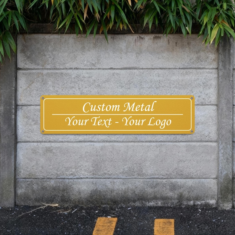May include: A rectangular, mustard-yellow metal sign with rounded corners is mounted on a concrete wall. The sign features the text "Custom Metal Your Text - Your Logo" in a white, elegant font. The sign is secured with small rivets.