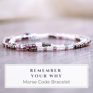 May include: A set of three ceramic mugs with a speckled, matte finish. Each mug features a different color: light blue, cream, and gray. The mugs have a simple, modern design and a comfortable handle.