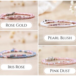 May include: Four beaded bracelets in rose gold, pearl blush, iris rose, and pink dust colors. Each bracelet is made of small, colorful beads strung together. The bracelets are displayed on a light-colored wooden surface.