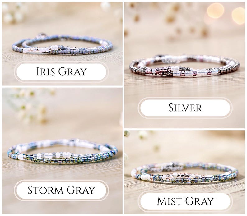 May include: Four beaded wrap bracelets in various colors: Iris Gray, Silver, Storm Gray, and Mist Gray. Each bracelet is made of small, colorful beads and is designed to wrap around the wrist multiple times. The names of the bracelets are displayed below each one.