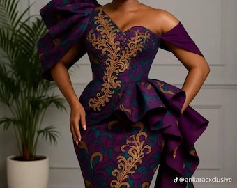 May include: A formal, one-shoulder gown in shades of purple, teal, and gold. The dress features a fitted bodice with gold embroidery, a peplum, and a mermaid skirt. A matching head wrap completes the ensemble. The Instagram handle @ankaraexclusive is visible.