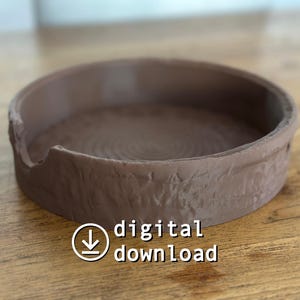 May include: A round, brown, ceramic tray with a textured exterior and a spiral pattern on the interior. The tray has a small notch on the side. The words "digital download" are printed on the image.