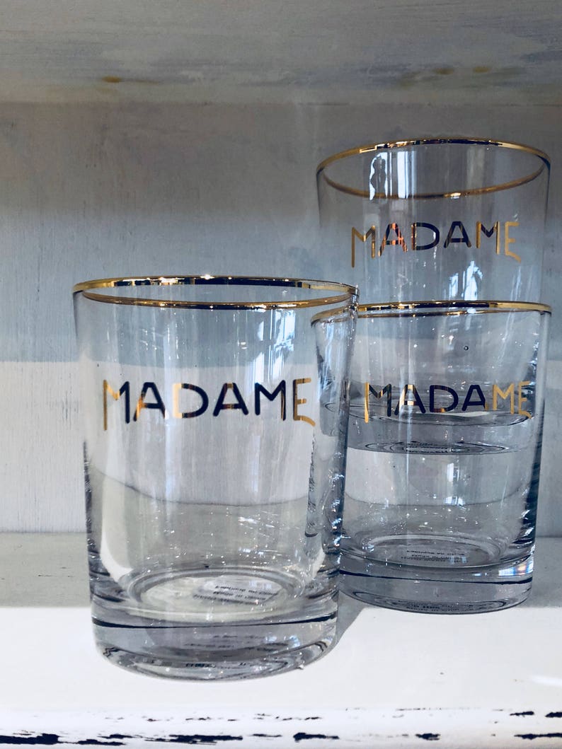 Madame and Monsieur glasses with gold rims.