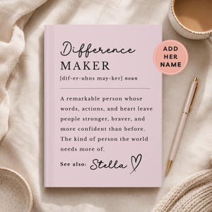 May include: A light pink notebook with black text defining the word Difference Maker. The text reads: A remarkable person whose words, actions, and heart leave people stronger, braver, and more confident than before. Includes a pink circular sticker.