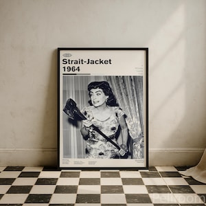 May include: Framed black and white movie poster for "Strait-Jacket" from 1964. The poster features a woman holding an axe, with the movie title and year at the top. The poster is displayed on a black and white checkered floor.