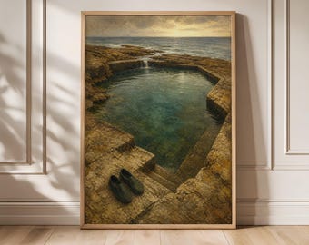 May include: A framed wall art print depicting a natural rock pool by the ocean at sunset. The scene features dark, textured stone edges surrounding deep green water, with a pair of dark slip-on shoes resting on the rocky ledge in the foreground.