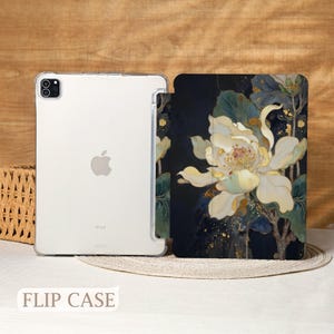 May include: A clear iPad case and a flip case with a floral design. The flip case features a large white flower with yellow and gold accents against a dark blue background. The text "FLIP CASE" is at the bottom.