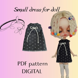 May include: A black doll dress with white polka dots and a white bow, next to a matching dress and a doll wearing the dress. The image also includes a drawing of a headband with leaves. Text reads "Small dress for doll" and "PDF pattern DIGITAL."