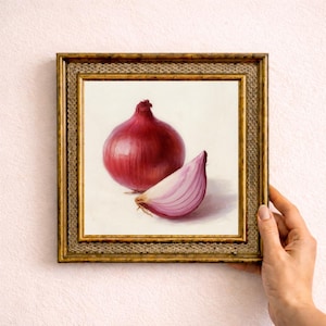 May include: A framed painting of a red onion and a slice. The artwork depicts a whole onion and a sectioned piece, both with detailed textures and realistic shading. The frame is gold with ornate detailing.