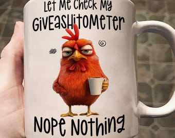 May include: White ceramic mug with a humorous design. The mug features a cartoon chicken holding a cup, with the text "Let Me Check My Giveashitometer Nope Nothing". The chicken is orange and red.