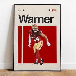 Puede incluir: Póster enmarcado con un jugador de fútbol americano con uniforme rojo y dorado, con el nombre "Warner" en letras negras grandes. El fondo es rojo vibrante con un borde color crema. El número "54" del jugador es visible.