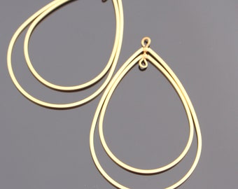 May include: Two gold teardrop shaped hoops with a double wire design. The hoops are open at the top and have a small loop for attaching to earrings.
