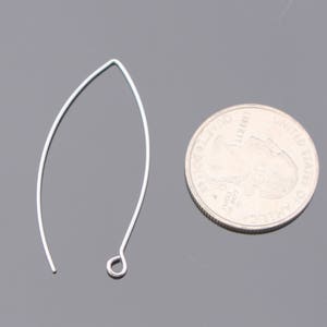 May include: A silver earring finding with a loop at the top and a curved wire that forms a teardrop shape.