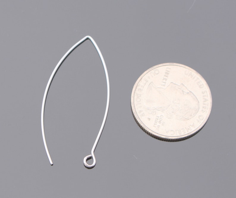 May include: A silver earring finding with a loop at the top and a curved wire that forms a teardrop shape.