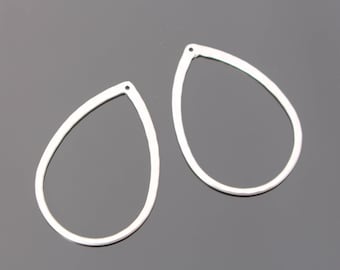 May include: Two silver teardrop-shaped earring blanks. The blanks are smooth and have a hole at the top for attaching earring hooks.
