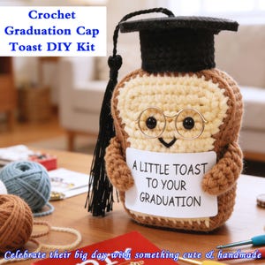 May include: A handmade crochet toast figure wearing a black graduation cap and glasses. The toast holds a sign that reads "A Little Toast to Your Graduation." The kit includes yarn and supplies for a DIY project.