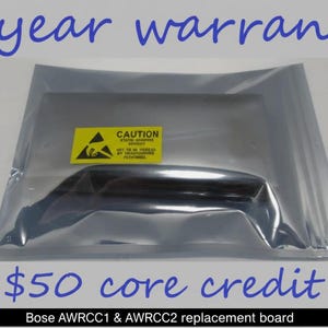 May include: A replacement board for Bose AWRCC1 & AWRCC2, sealed in a clear, metallic bag. A yellow caution label is visible. The text "5 year warranty" and "core credit" are written in blue.