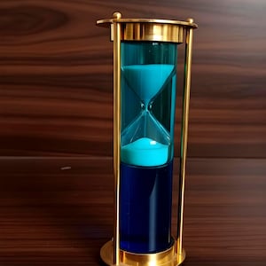 May include: An hourglass with a blue liquid and a brass frame. The hourglass has a cylindrical shape with a narrow neck connecting the two glass bulbs. The base and top are circular, and the frame is a gold color.