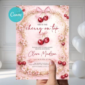 May include: A pink baby shower invitation with a cherry theme. The invitation features the text "She is the cherry on top" and "Clara Mudson". The design includes cherries, bows, and floral accents.