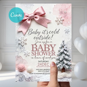 May include: Baby shower invitation with a winter theme. The invitation features a pink bow, snowflakes, and a small Christmas tree. Text includes "Baby it's cold outside!" and shower details.