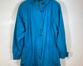 May include: A teal blue hooded jacket with a zipper and button closure. The jacket has a drawstring waist and two pockets.