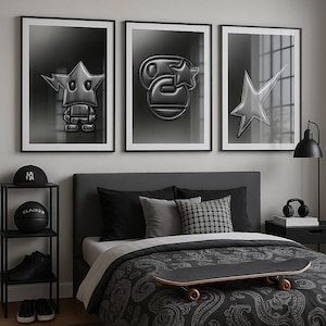 May include: Three framed monochrome art prints with star designs adorn a bedroom wall. A black skateboard lies on the bed's patterned duvet cover. A small black shelf displays a baseball cap, basketball, and trainers.
