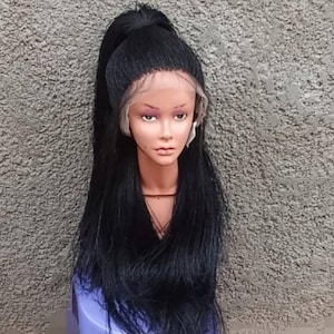 May include: A black wig with long, straight hair and a high ponytail. The wig is styled on a mannequin head with a realistic skin tone. The wig's lace front is visible, and the hair is a deep, rich black color.