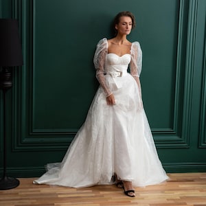 Lace corset wedding dress with long sleeves and a long train. Classic A-line wedding gown with an open back. Unique tulle bridal dress TORY