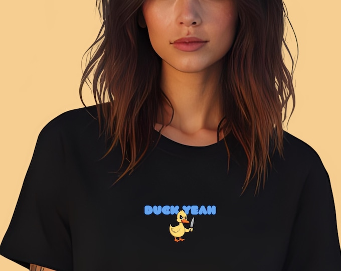 Duck Yeah Graphic T-Shirt – Humorous Duck with Knife Design, Funny Animal Tee, Playful Novelty Shirt for Casual Wear