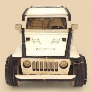 May include: A wooden model of a light-colored SUV with dark brown tires and accents. The vehicle has a detailed front grille, side mirrors, and visible interior seats. The toy car is designed with a boxy shape.